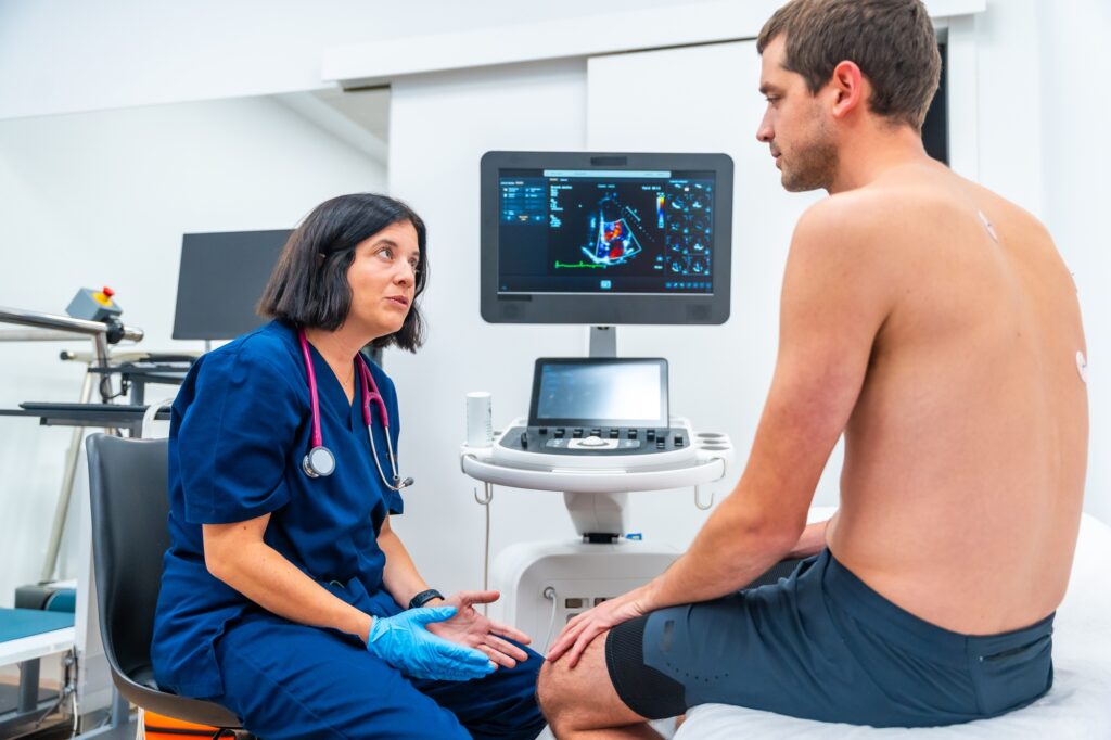 Patient and cardiologist looking at the results of an echocardiogram